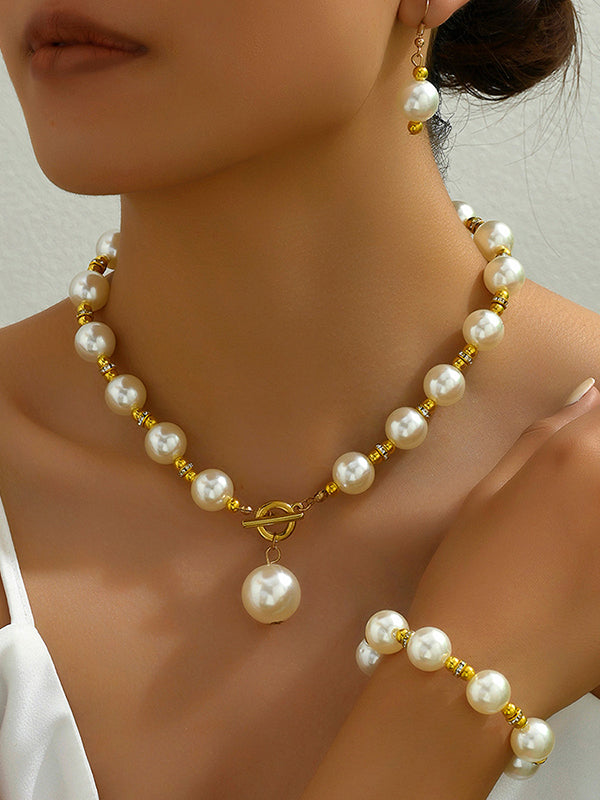 Parure bracelet, boucles d'oreilles pendantes et collier géométrique