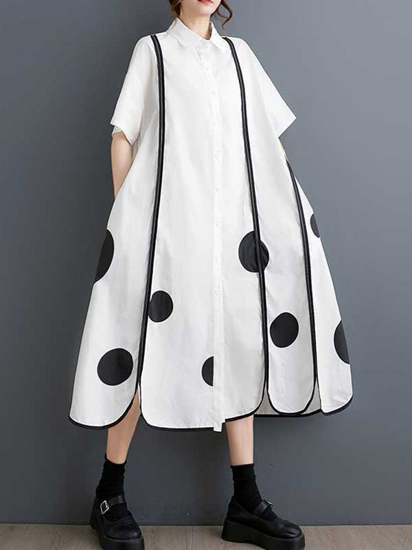 Robe chemise boutonnée fendue devant coupe trapèze, à manches mi-longues, à poches, à pois, à empiècements, à col revers