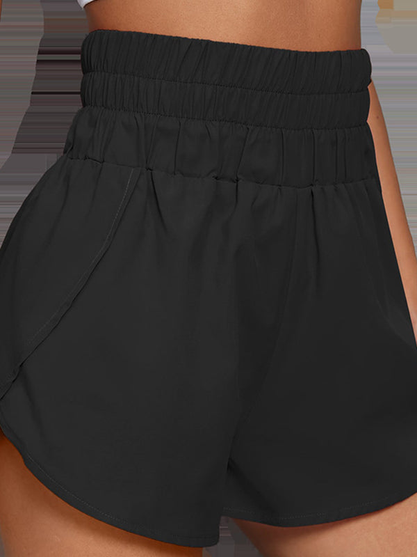 Short ample taille haute, à taille élastique, à empiècements, couleur unie