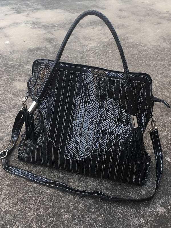 Sac en cuir à bandoulière rayé à empiècements