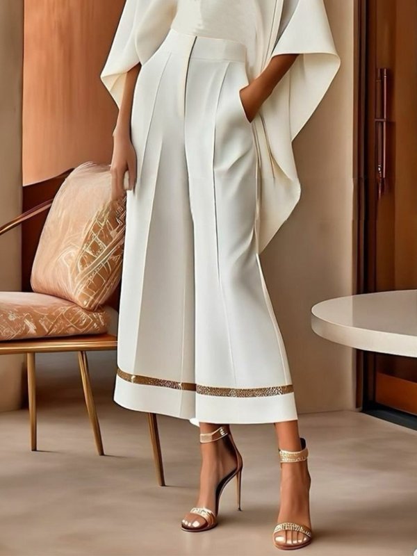 Pantalon à jambes larges, à poches, couleur unie