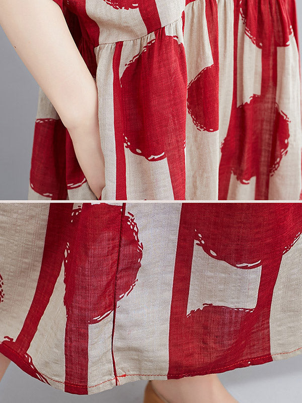 Robe mi-longue à pois, à empiècements, à col rond