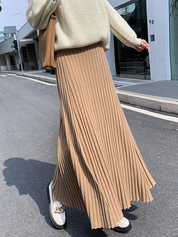 Jupe plissée coupe trapèze, taille haute, couleur unie