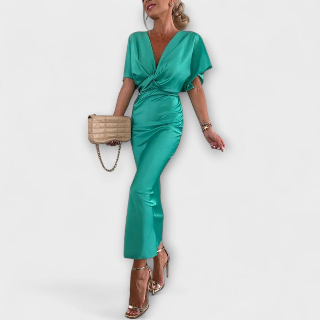 Sable - Robe maxi à décolleté en V avec nœud croisé et coupe ajustée en satin de haute qualité