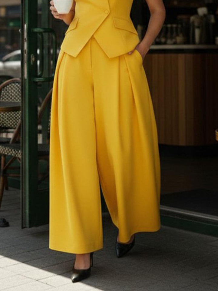 Pantalon ample plissé taille haute, à empiècements, couleur unie