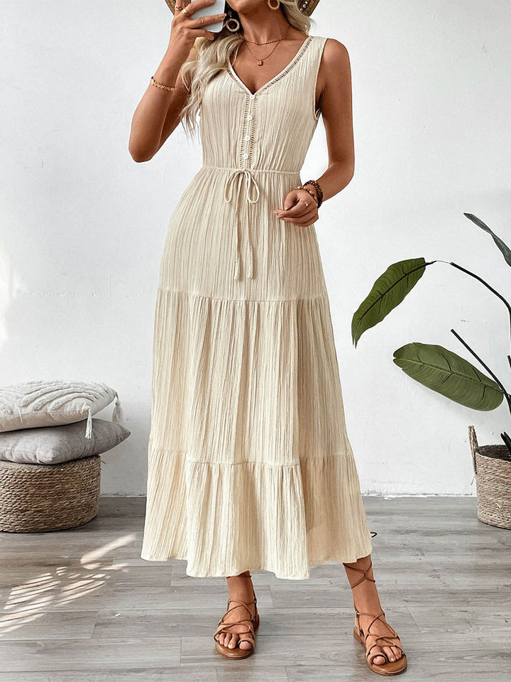Robe longue boutonnée plissée coupe trapèze, taille haute, à taille nouée, à col en V, couleur unie