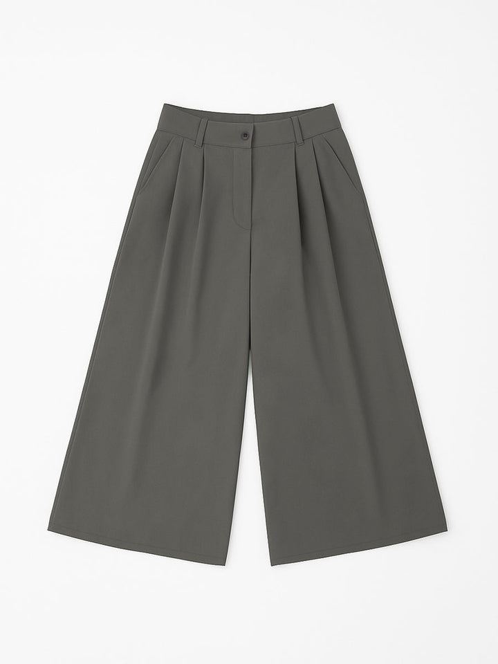 Pantalon ample plissé taille haute, à empiècements, couleur unie