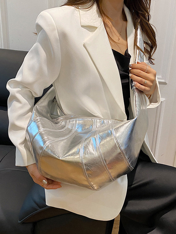 Sac bandoulière géométrique à empiècements, à fermeture éclair