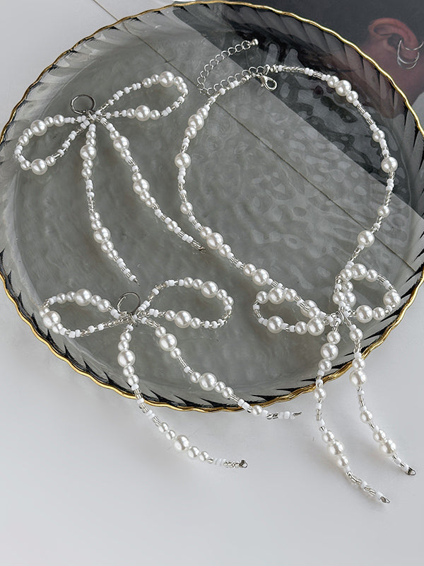 Parure boucles d'oreilles pendantes et collier à nœud