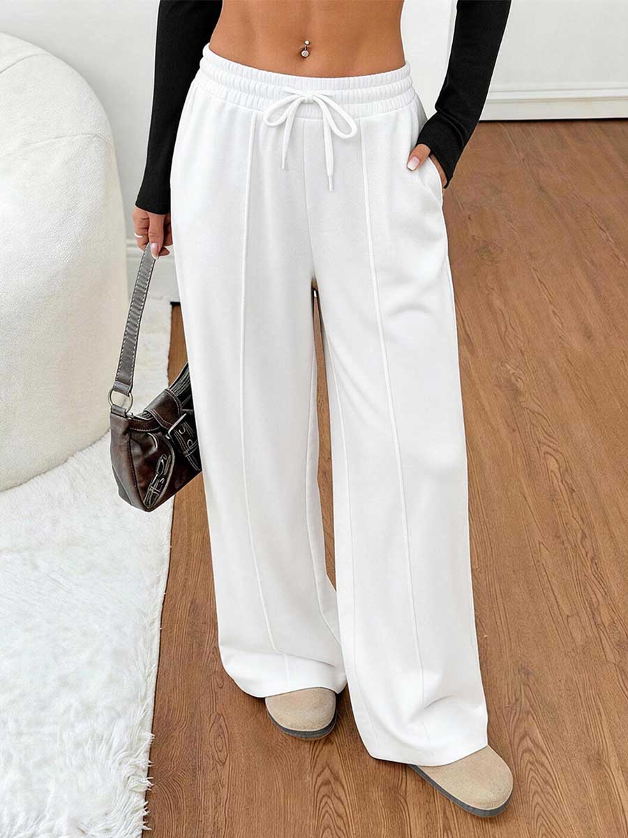 Pantalon ample à poches, à taille élastique, à cordon de serrage, à jambes larges, couleur unie