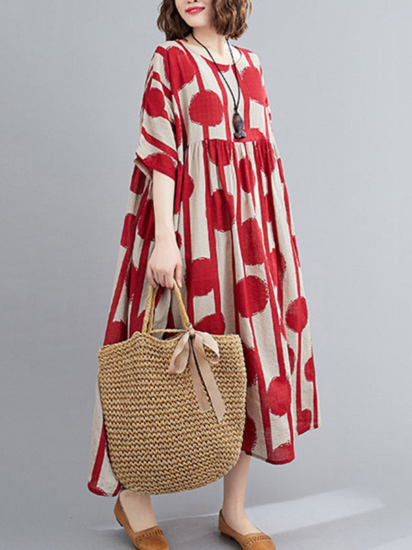 Robe mi-longue à pois, à empiècements, à col rond