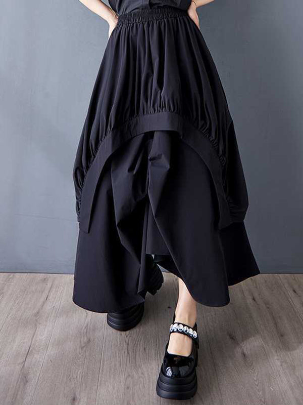 Jupe ample asymétrique plissée coupe trapèze, à taille élastique, à poches, couleur unie