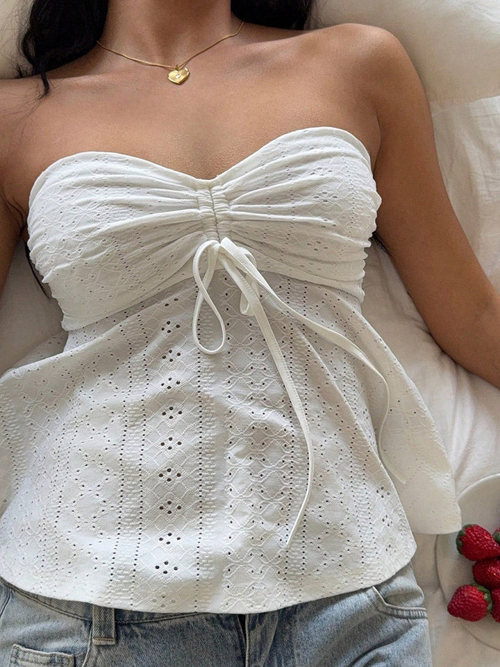 Débardeur ajouré plissé noué coupe près du corps, sans manches, dos nu, à empiècements, bustier, couleur unie