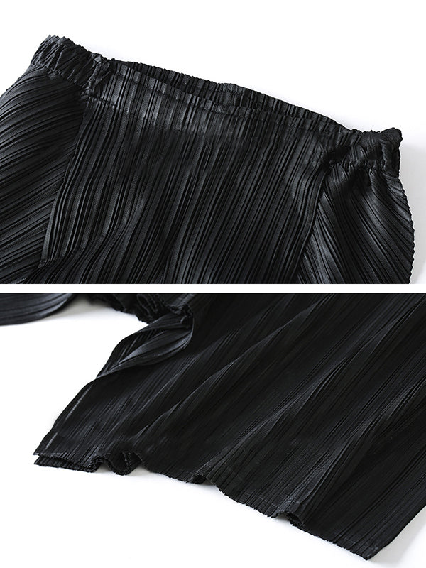 Pantalon ample original à jambes larges plissées irrégulières de couleur unie