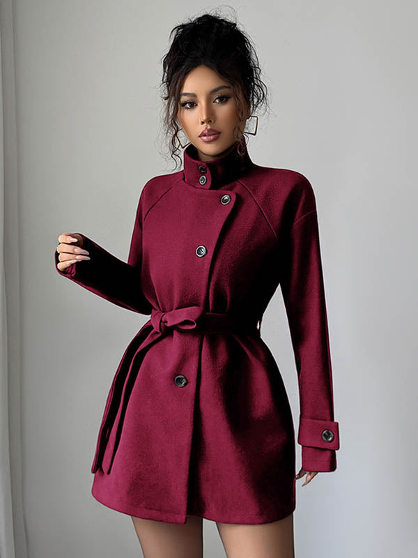 Veste asymétrique boutonnée à taille élastique, taille haute, à taille nouée, à col montant, couleur unie