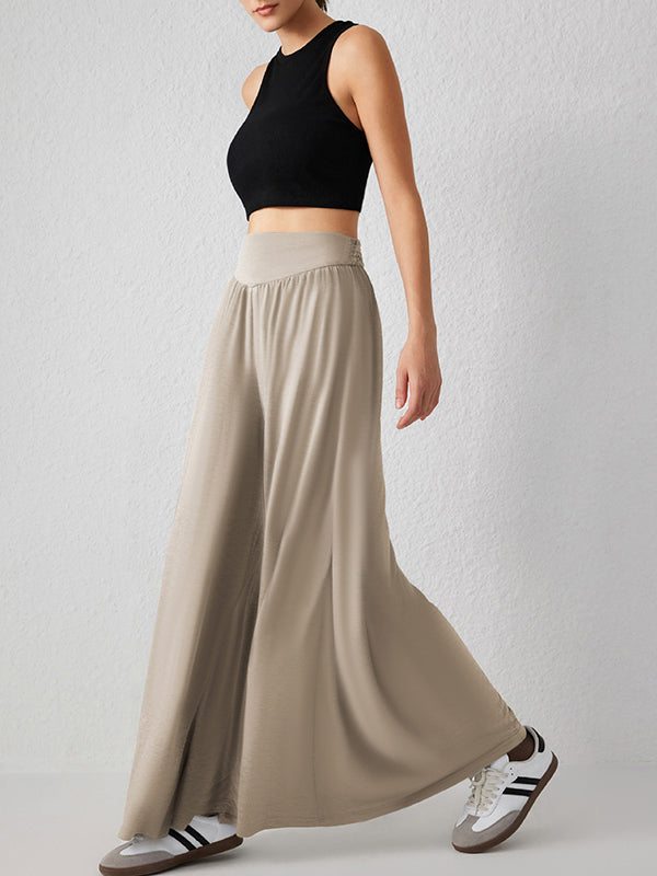 Pantalon ample plissé taille haute, à poches, à empiècements, couleur unie
