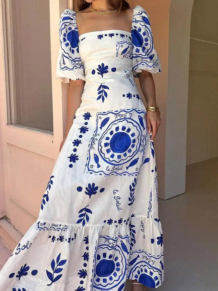 Robe mi-longue plissée imprimée volantée coupe trapèze, taille haute, à empiècements, à col carré, couleur contrastée