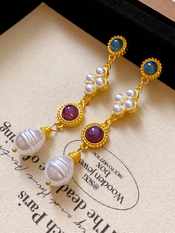 Boucles d'oreilles pendantes géométriques à pompons