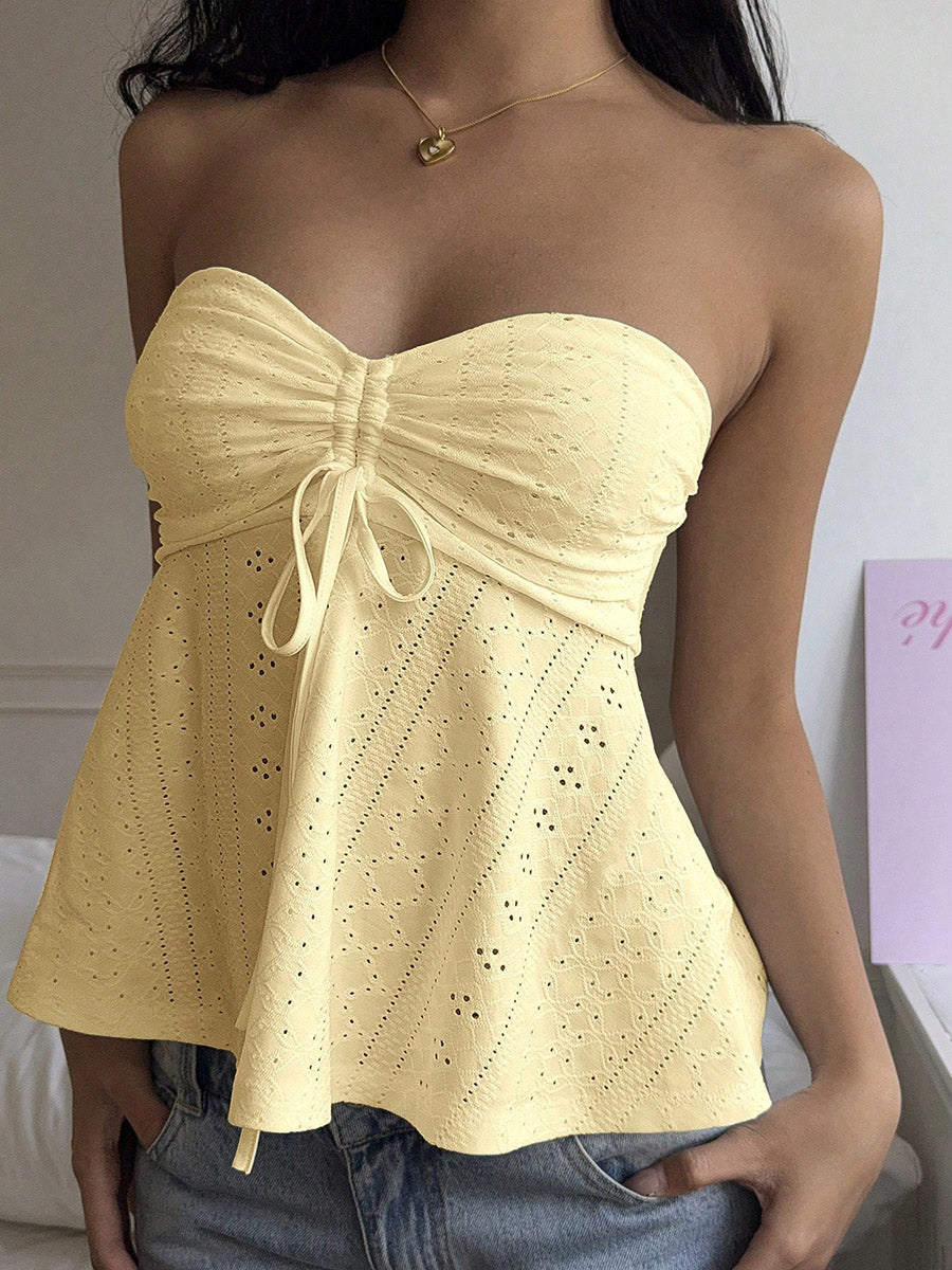 Débardeur ajouré plissé noué coupe près du corps, sans manches, dos nu, à empiècements, bustier, couleur unie