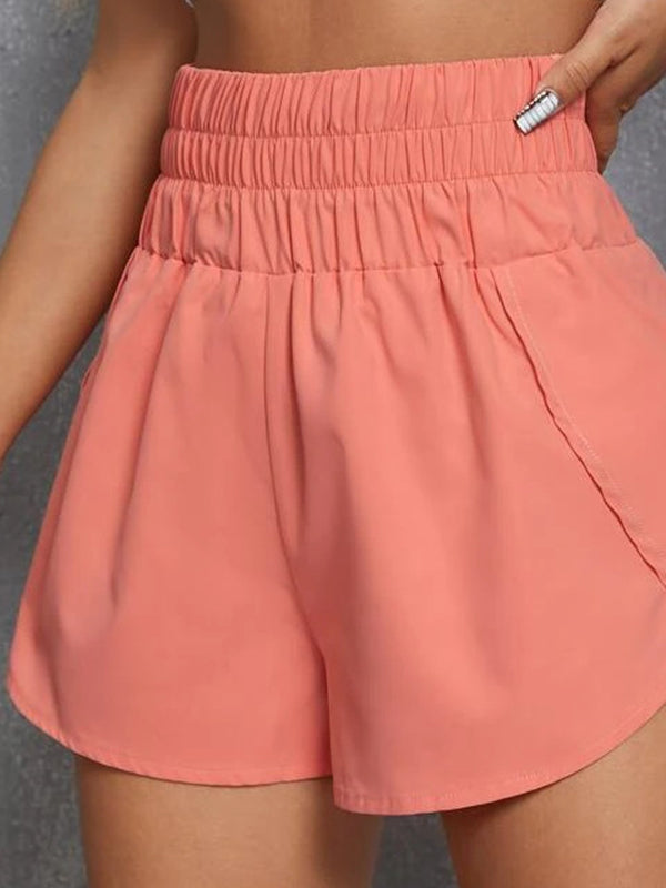 Short ample taille haute, à taille élastique, à empiècements, couleur unie