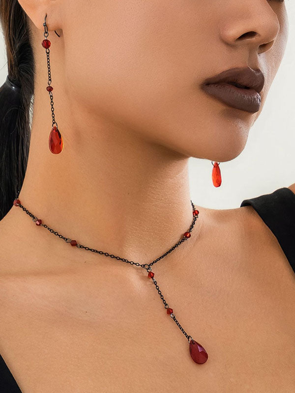 Boucles d'oreilles pendantes géométriques à pompons