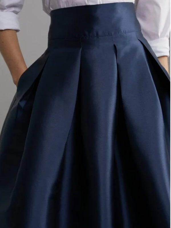 Jupe plissée coupe trapèze, taille haute, à fermeture éclair, couleur unie