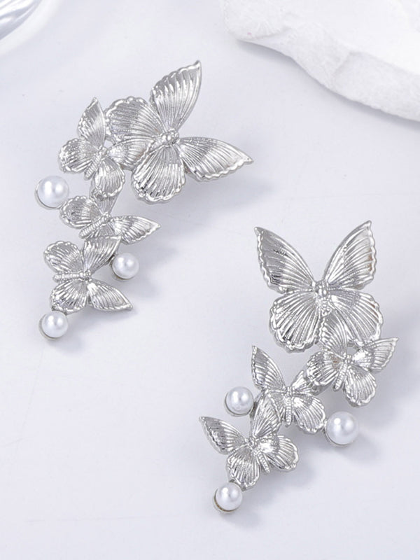 Boucles d'oreilles brillantes en forme de papillon