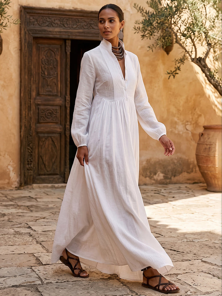 Robe chemise boutonnée plissée coupe trapèze, à poches, à empiècements, à col montant, couleur unie