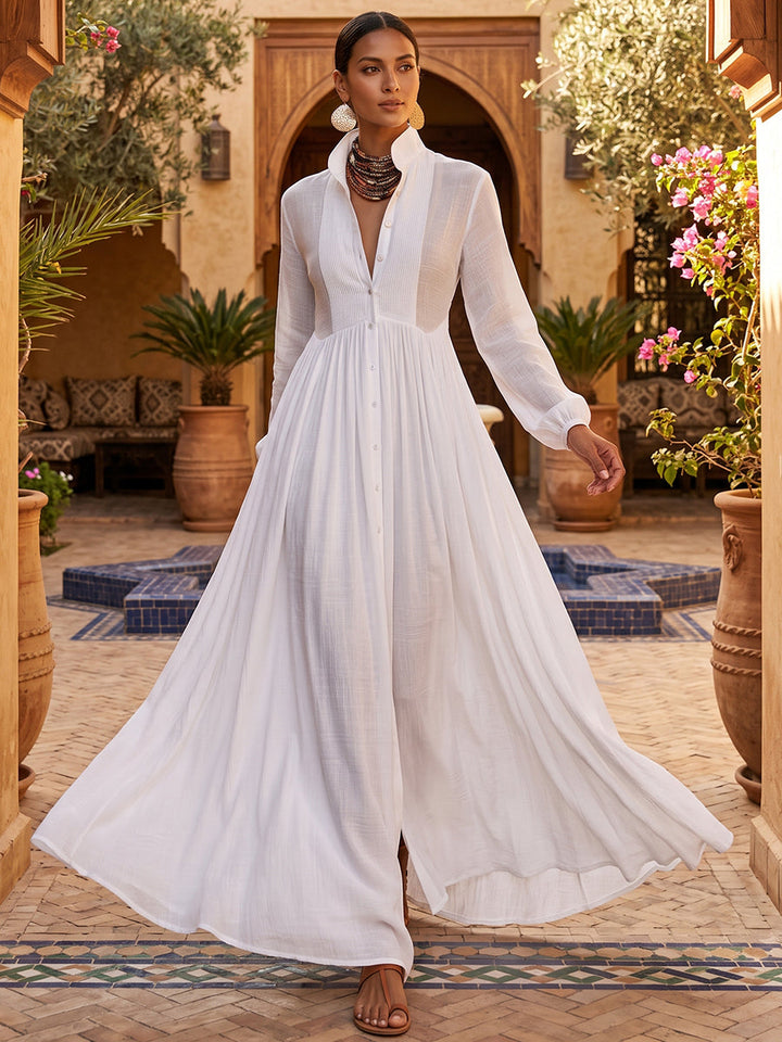 Robe chemise boutonnée plissée coupe trapèze, à poches, à empiècements, à col montant, couleur unie