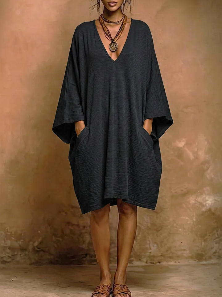 Robe mi-longue ample à manches chauve-souris, à poches, à décolleté en V profond, couleur unie