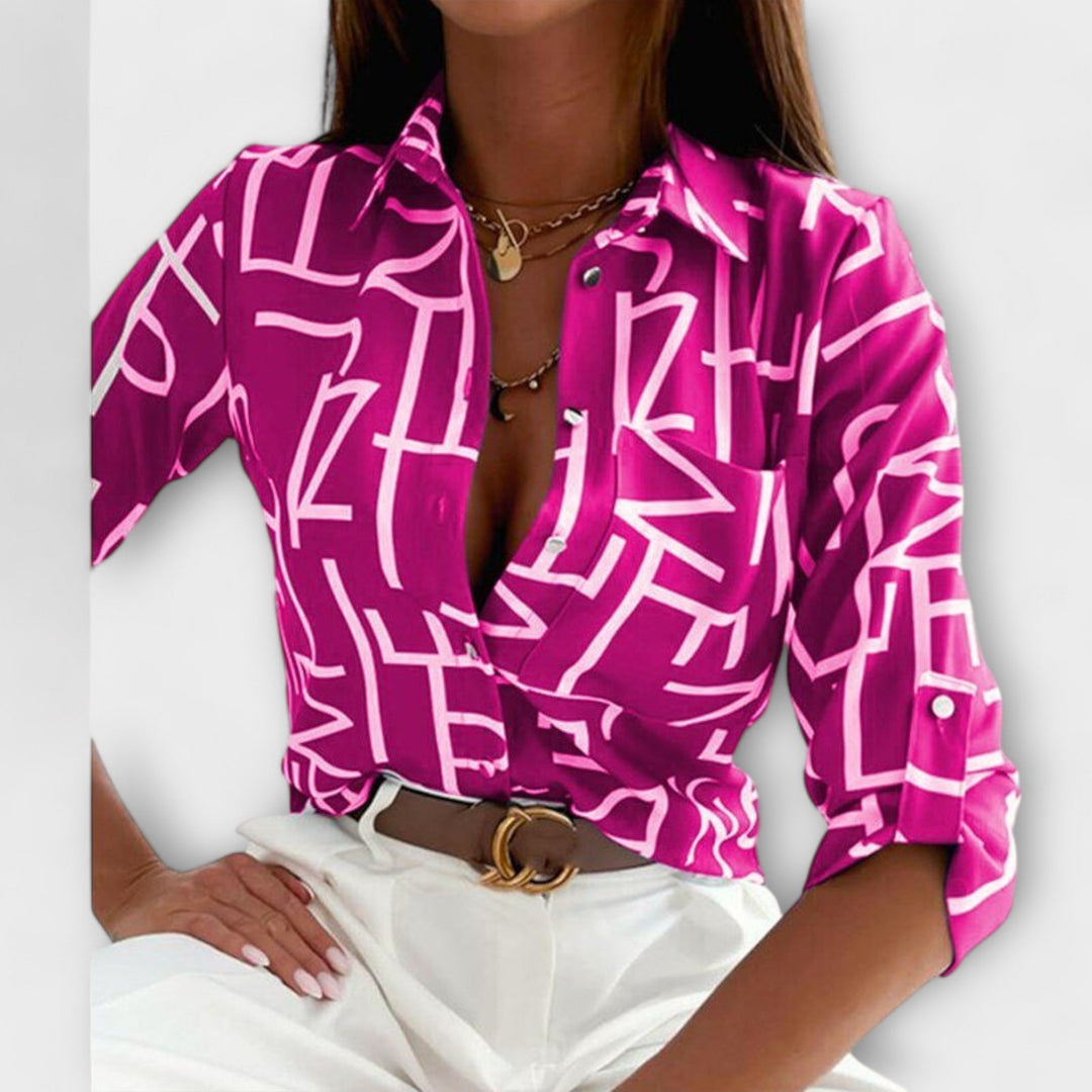 Lorena – Blouse avec imprimé graphique et flair rétro