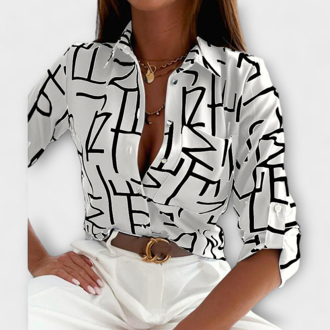 Lorena – Blouse avec imprimé graphique et flair rétro