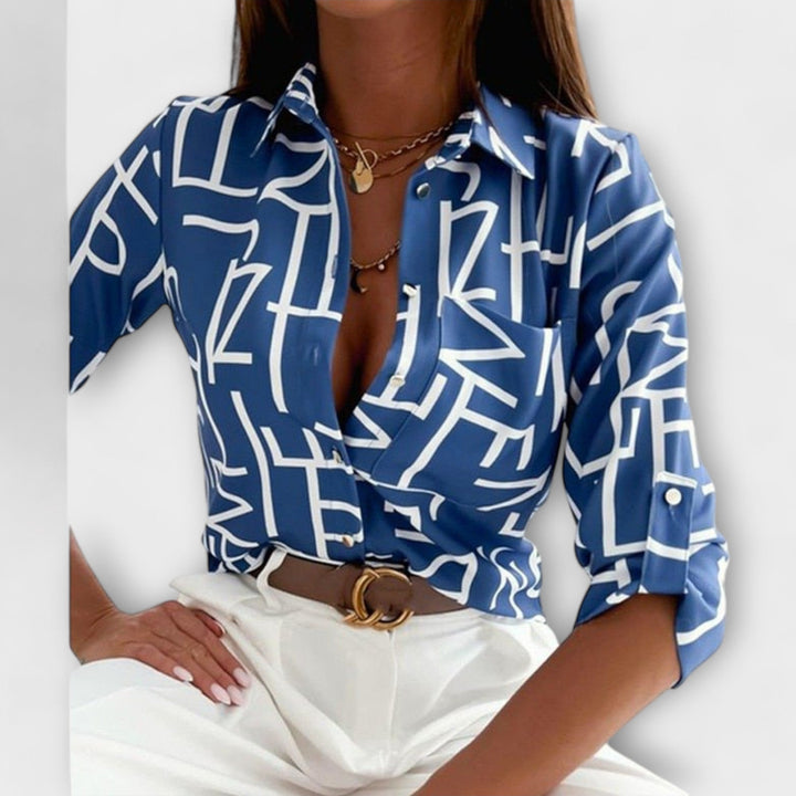 Lorena – Blouse avec imprimé graphique et flair rétro