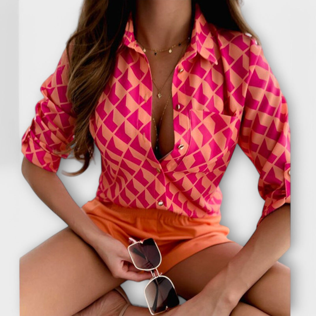 Lorena – Blouse avec imprimé graphique et flair rétro