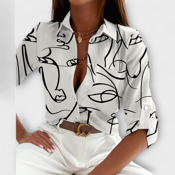 Lorena – Blouse avec imprimé graphique et flair rétro